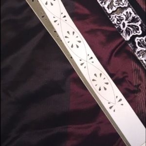 One replacement guitar/purse strap and a belt